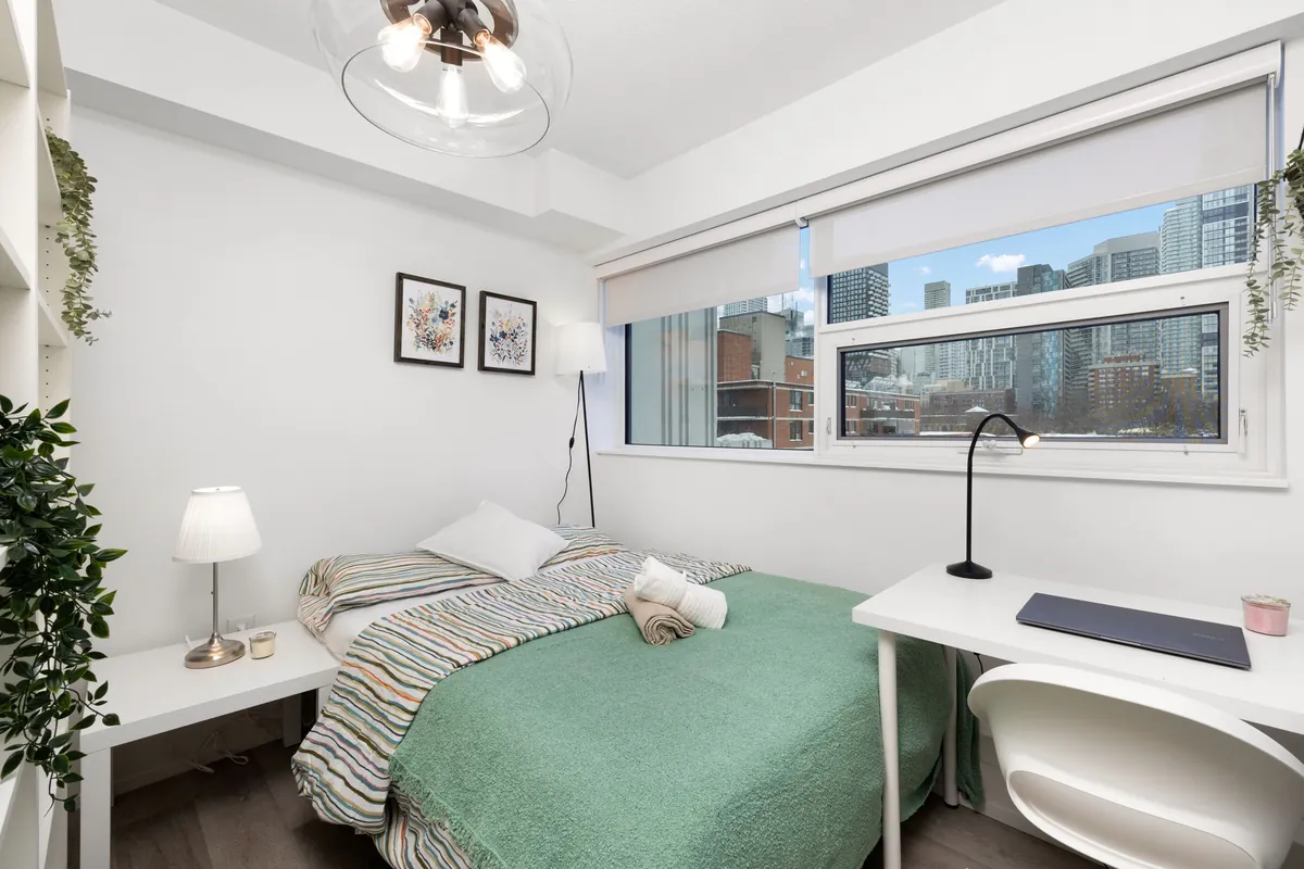 Flex Plus bedroom with a full bed beside a window wall