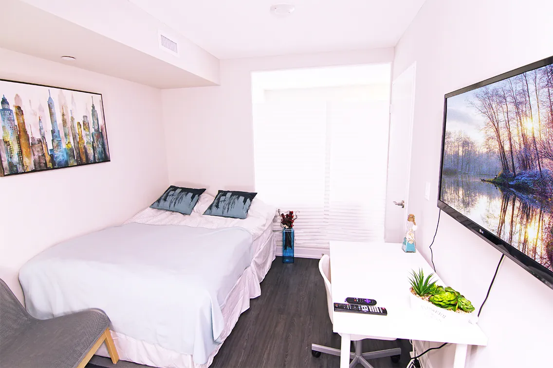 Bedroom in the one-bedroom suite with a full bed
