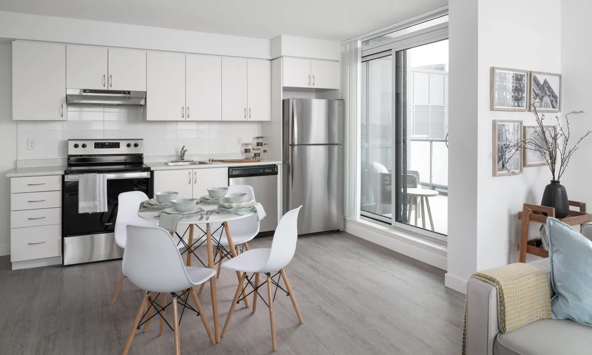 Kitchen and dining area with a balcony door